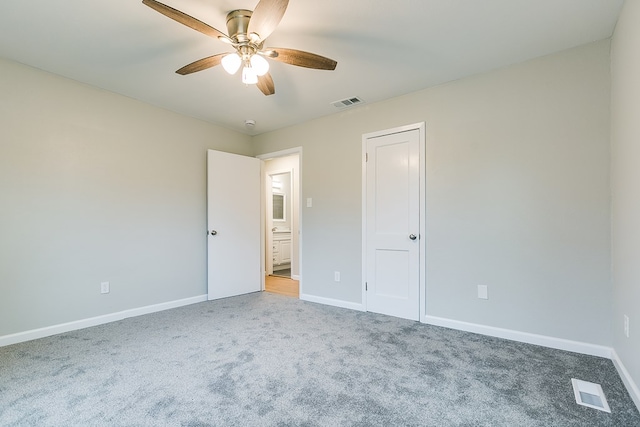 unfurnished bedroom with ceiling fan and carpet flooring