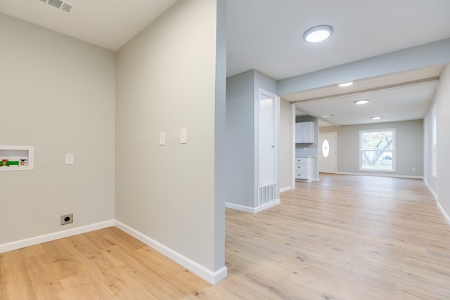 laundry area with washer hookup, hookup for an electric dryer, and light hardwood / wood-style flooring