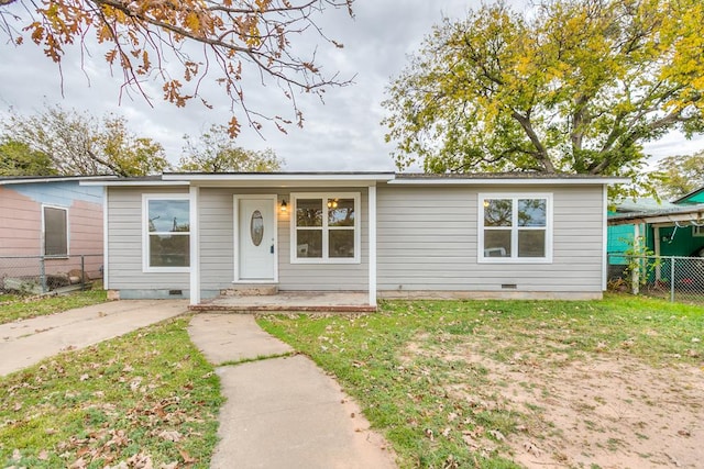 ranch-style home with a front yard