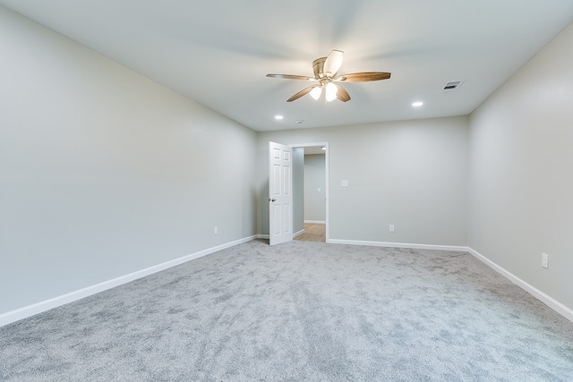 empty room featuring carpet floors and ceiling fan