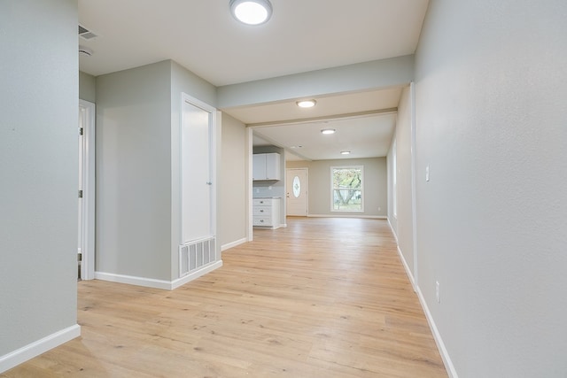 hall with light hardwood / wood-style flooring