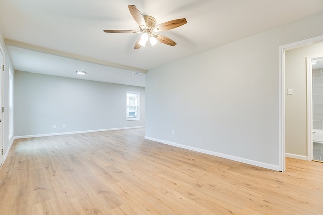 unfurnished room with ceiling fan and light wood-type flooring