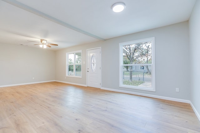 interior space with plenty of natural light, ceiling fan, and light hardwood / wood-style flooring