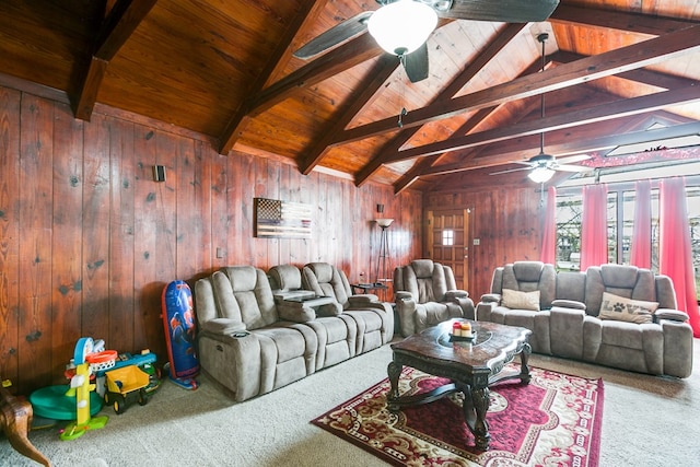 living area featuring lofted ceiling with beams, carpet floors, wooden walls, and a ceiling fan