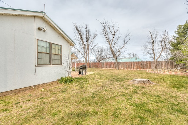 view of yard featuring a patio area and fence