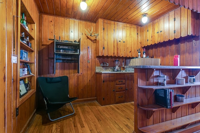 kitchen featuring open shelves, wood ceiling, wood finished floors, and brown cabinetry