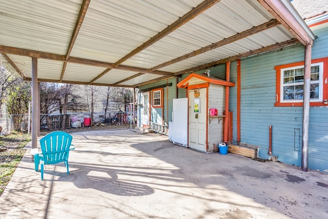 110 N Pope St, San Angelo, TX 76903 - view of patio featuring an attached carport