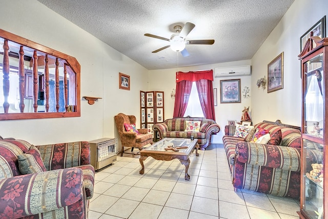 110 N Pope St, San Angelo, TX 76903 - tiled living area featuring a textured ceiling, an AC wall unit, and ceiling fan