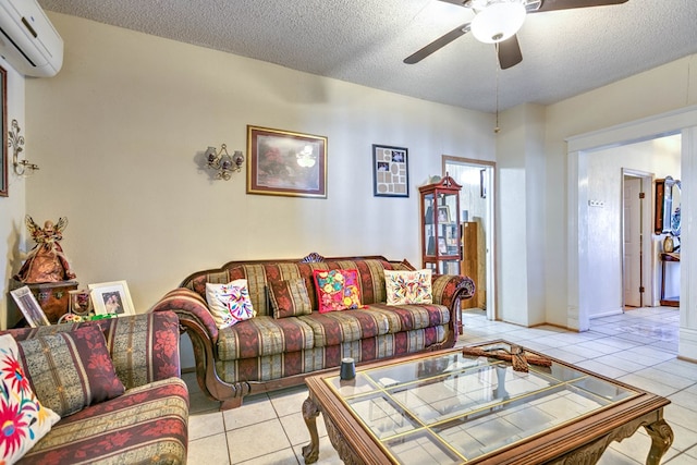 110 N Pope St, San Angelo, TX 76903 - living area with a wall mounted air conditioner, light tile patterned floors, a ceiling fan, and a textured ceiling