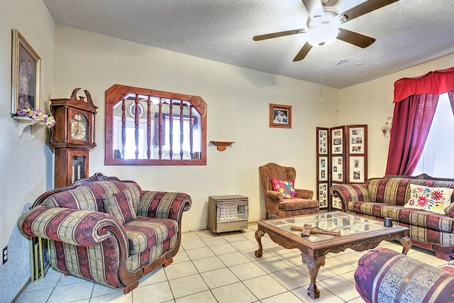 110 N Pope St, San Angelo, TX 76903 - living room with ceiling fan, a textured ceiling, and tile patterned flooring