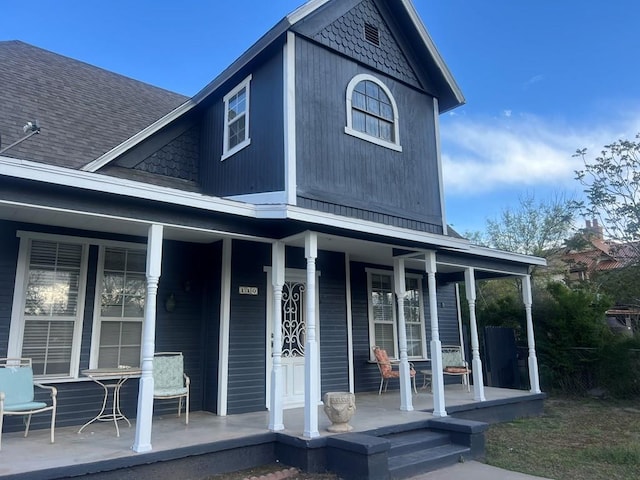110 N Pope St, San Angelo, TX 76903 - view of front of home featuring a porch and a shingled roof