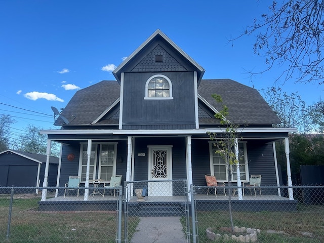 110 N Pope St, San Angelo, TX 76903 - view of front of house featuring a porch, roof with shingles, a fenced front yard, and a gate
