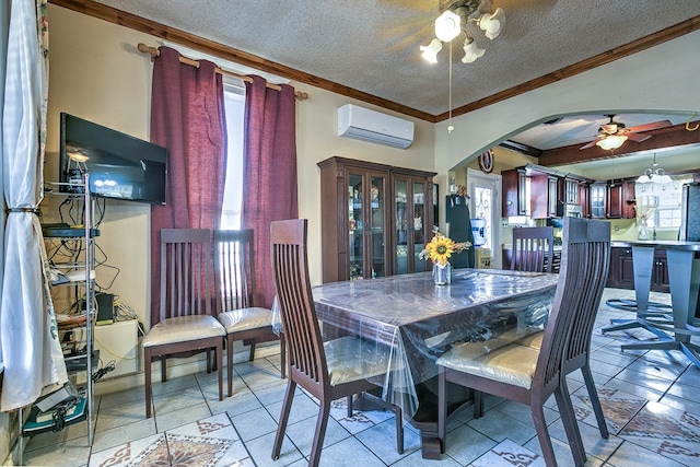 110 N Pope St, San Angelo, TX 76903 - dining room featuring a wall unit AC, ceiling fan, ornamental molding, a textured ceiling, and arched walkways