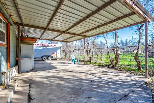 110 N Pope St, San Angelo, TX 76903 - view of patio featuring an attached carport