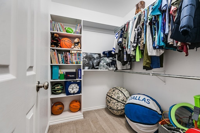 walk in closet featuring carpet