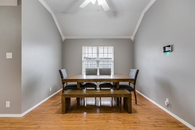 dining space with light hardwood / wood-style flooring, ornamental molding, and ceiling fan