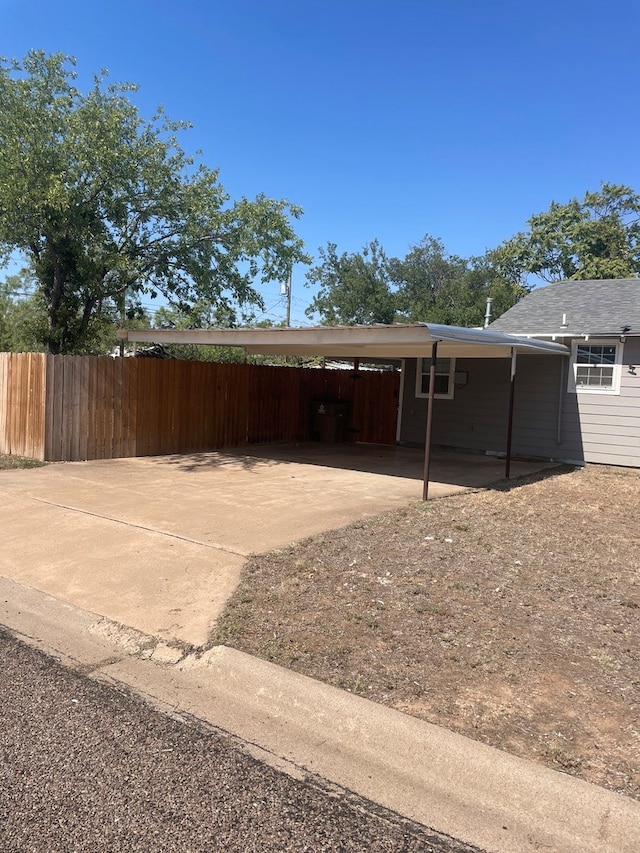 exterior space featuring a carport