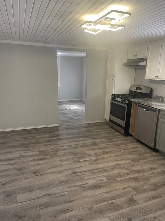 kitchen featuring dark wood-type flooring, white cabinetry, wood ceiling, crown molding, and stainless steel appliances