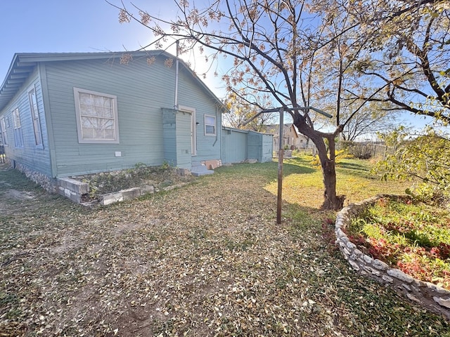 back of property with a lawn