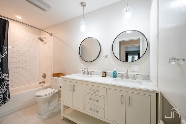 2301 Sul Ross St, San Angelo, TX 76904 - bathroom with shower / tub combo, toilet, tile patterned flooring, and a sink