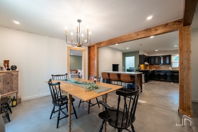 2301 Sul Ross St, San Angelo, TX 76904 - dining area with recessed lighting, beam ceiling, baseboards, finished concrete flooring, and a notable chandelier