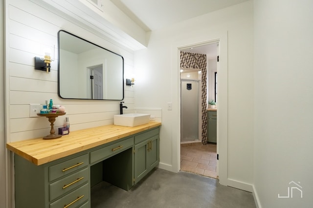 2301 Sul Ross St, San Angelo, TX 76904 - bathroom featuring baseboards, vanity, finished concrete floors, and a stall shower
