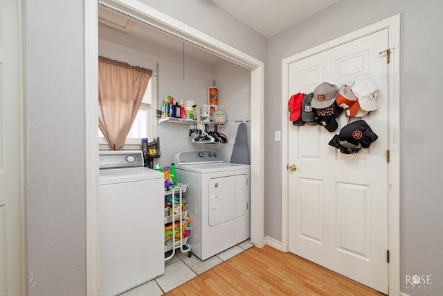 laundry area featuring wood-type flooring and washer and dryer