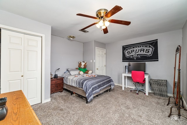 bedroom with carpet floors, a closet, and ceiling fan