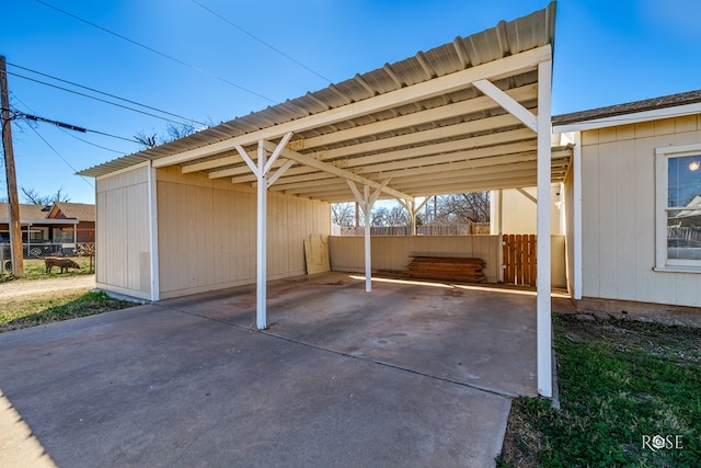 view of vehicle parking featuring a carport