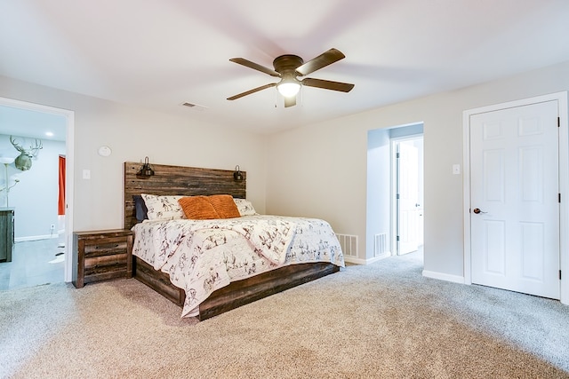 bedroom with visible vents, carpet flooring, baseboards, and ceiling fan
