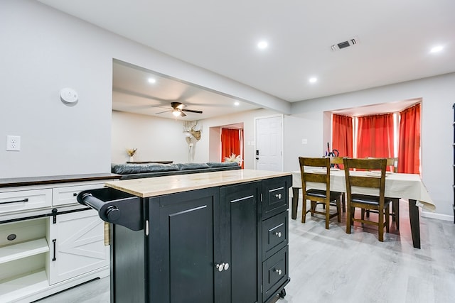 kitchen with white cabinets, visible vents, dark cabinetry, and recessed lighting