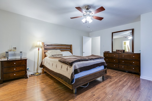 bedroom with hardwood / wood-style flooring and ceiling fan