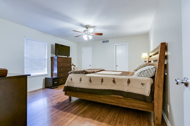 bedroom with wood-type flooring and ceiling fan