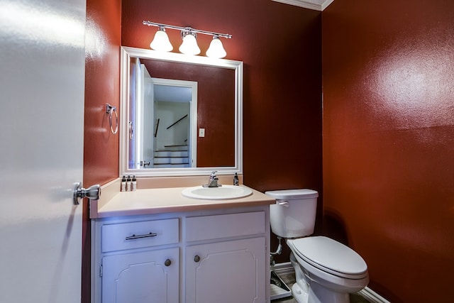 bathroom featuring vanity and toilet