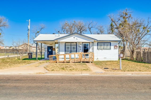 view of front of house with a porch and a front yard