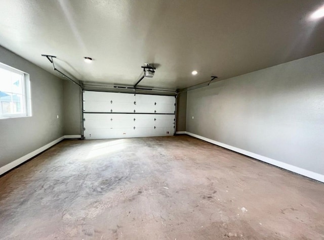 1958 Beaty Rd, San Angelo, TX 76904 - garage featuring a garage door opener and baseboards