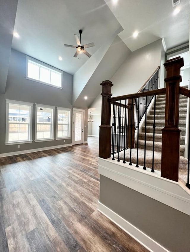 1958 Beaty Rd, San Angelo, TX 76904 - unfurnished living room featuring a ceiling fan, recessed lighting, wood finished floors, high vaulted ceiling, and baseboards