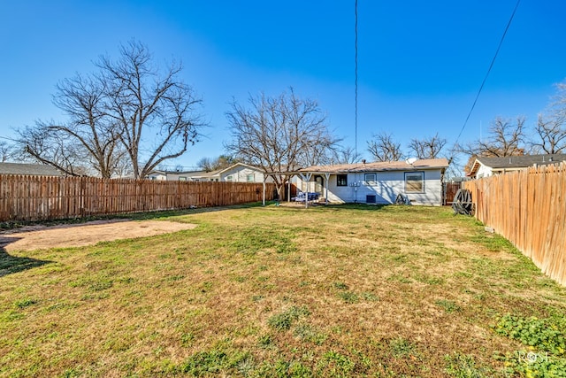 view of yard with a fenced backyard