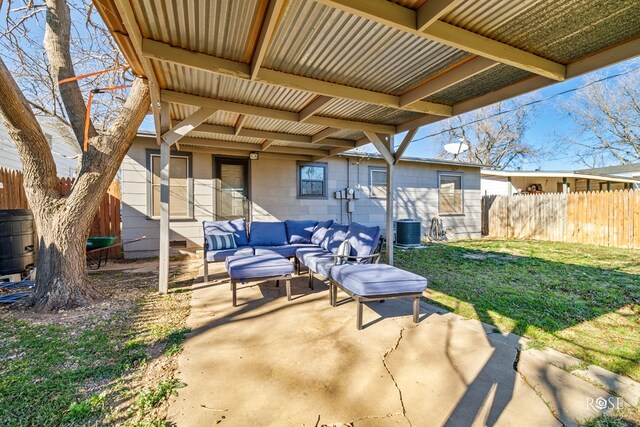 view of patio with central AC unit, outdoor lounge area, and fence