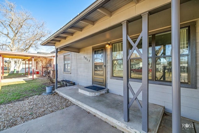 property entrance featuring covered porch