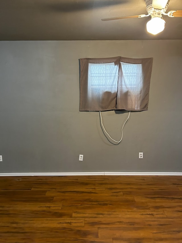 spare room featuring ceiling fan and hardwood / wood-style floors