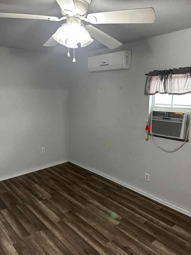 spare room with ceiling fan, dark hardwood / wood-style flooring, and a wall unit AC