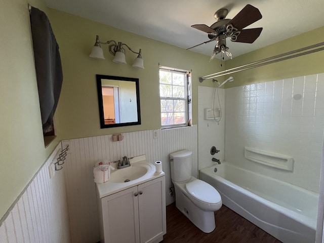 full bathroom featuring toilet, shower / tub combination, vanity, ceiling fan, and hardwood / wood-style floors