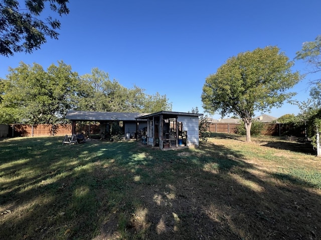 rear view of house with a yard