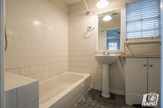 bathroom featuring shower / bath combination and tile walls