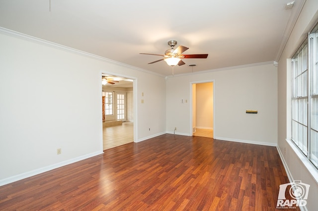 empty room with dark wood-type flooring, ceiling fan, and crown molding