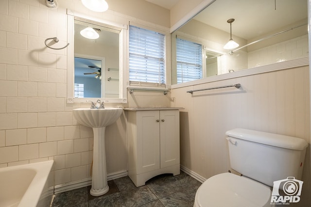 bathroom featuring shower / washtub combination and toilet