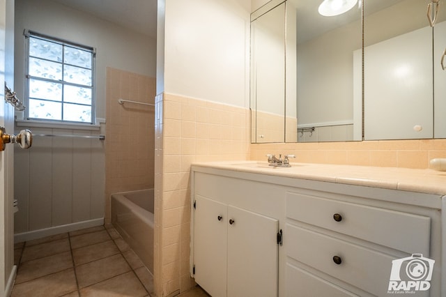 bathroom featuring tile patterned flooring and vanity