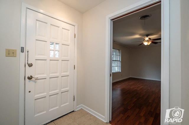 entrance foyer with ceiling fan and light hardwood / wood-style floors