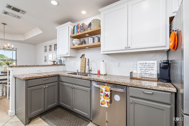 kitchen featuring sink, gray cabinets, appliances with stainless steel finishes, white cabinets, and kitchen peninsula